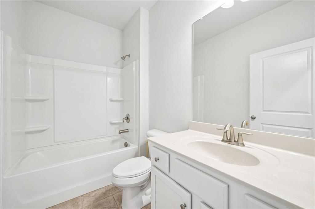 3431 High Shoals Buford, GA 30519 - Photo 23 of 51 a bathroom with a sink a toilet and a bathtub