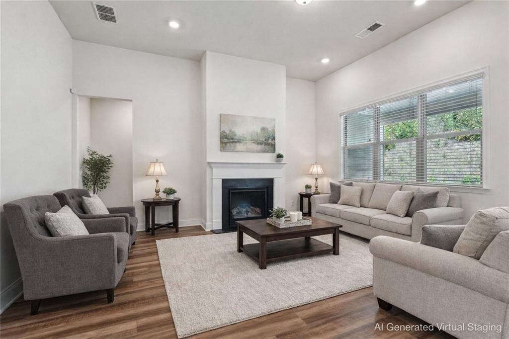 3431 High Shoals Buford, GA 30519 - Photo 6 of 51 a living room with furniture and a fireplace
