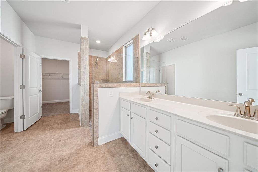 3431 High Shoals Buford, GA 30519 - Photo 9 of 51 a spacious bathroom with a double vanity sink mirror and double