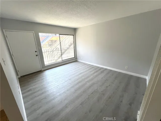 a kitchen with a cabinets and window