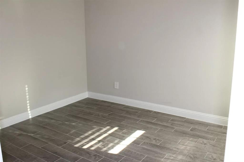 1752 Redding Street Allen, TX 75002 - Photo 17 of 24 Spare room featuring dark hardwood / wood-style floors