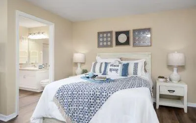 a bedroom with a bed and a view of bathroom