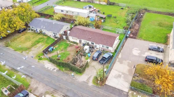 an aerial view of houses with yard
