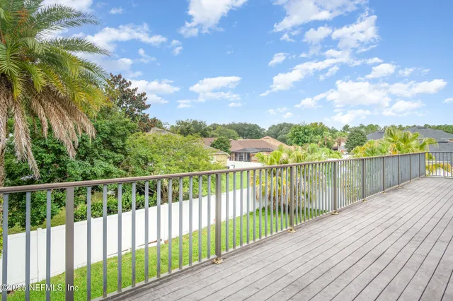 a view of balcony with wooden floor