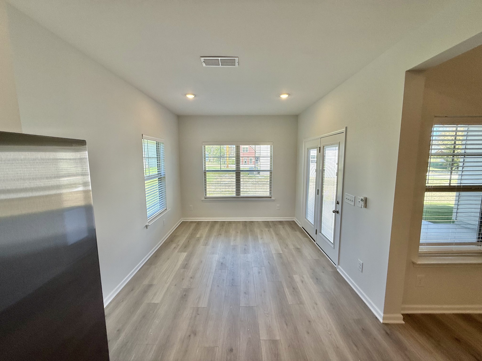 25 Ellie Jan Way Manchester, TN 37355 - Photo 5 of 12 a view of empty room with wooden floor and fan