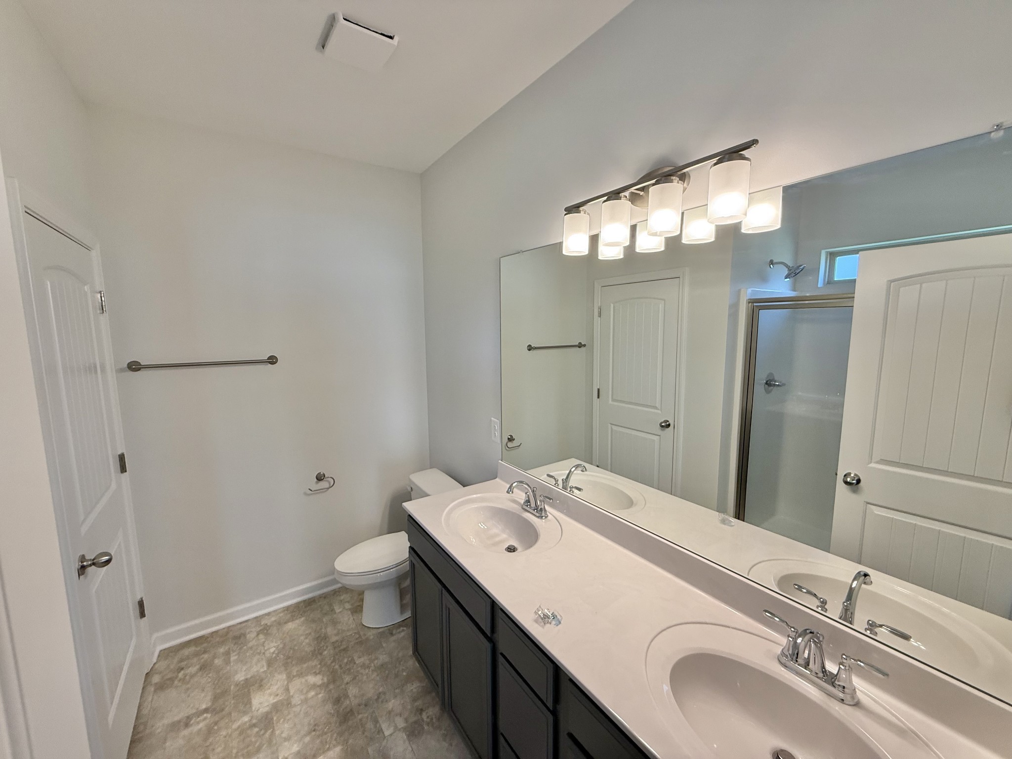 25 Ellie Jan Way Manchester, TN 37355 - Photo 8 of 12 a bathroom with a sink a toilet and shower