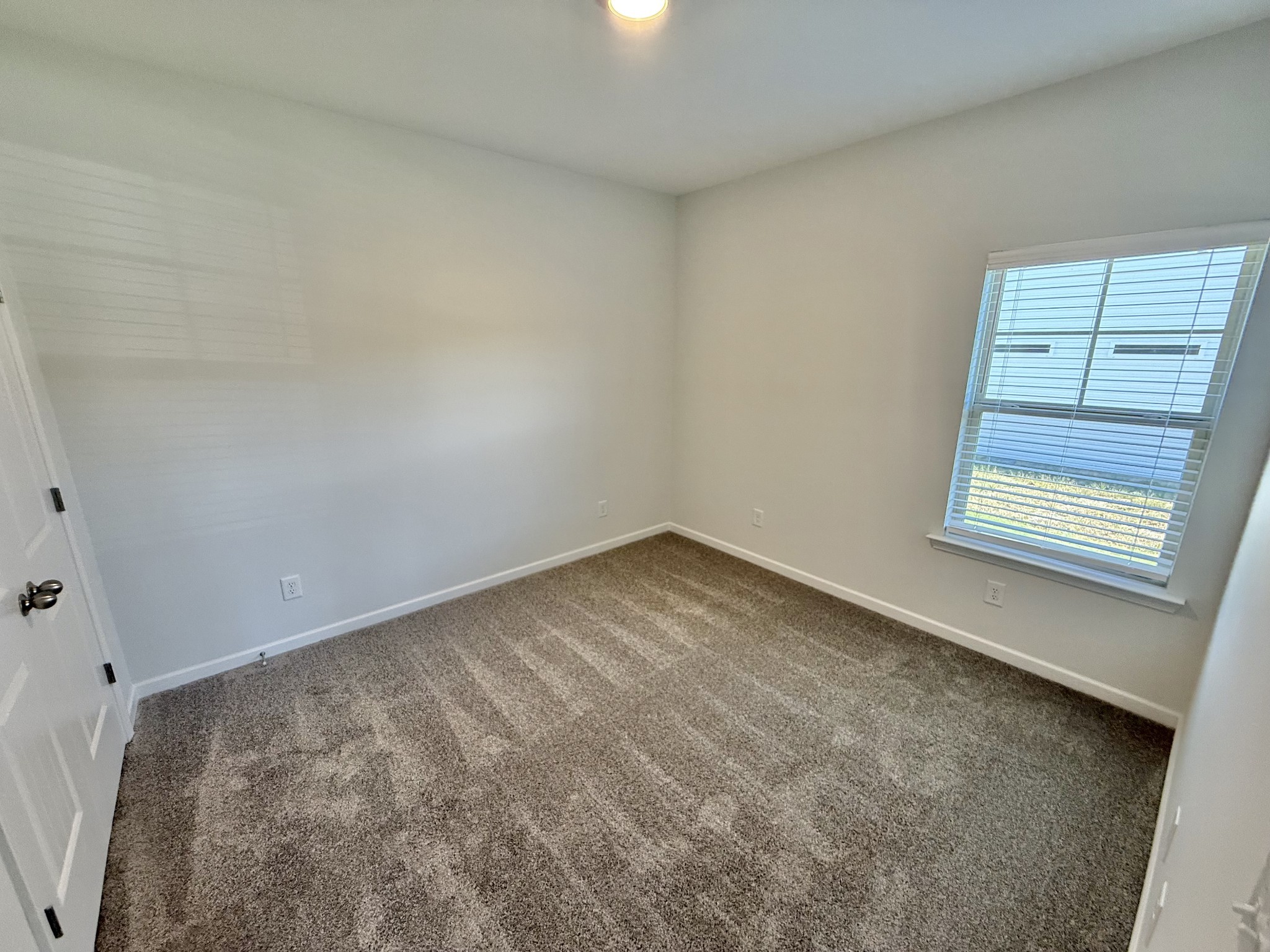 25 Ellie Jan Way Manchester, TN 37355 - Photo 10 of 12 an empty room with a window