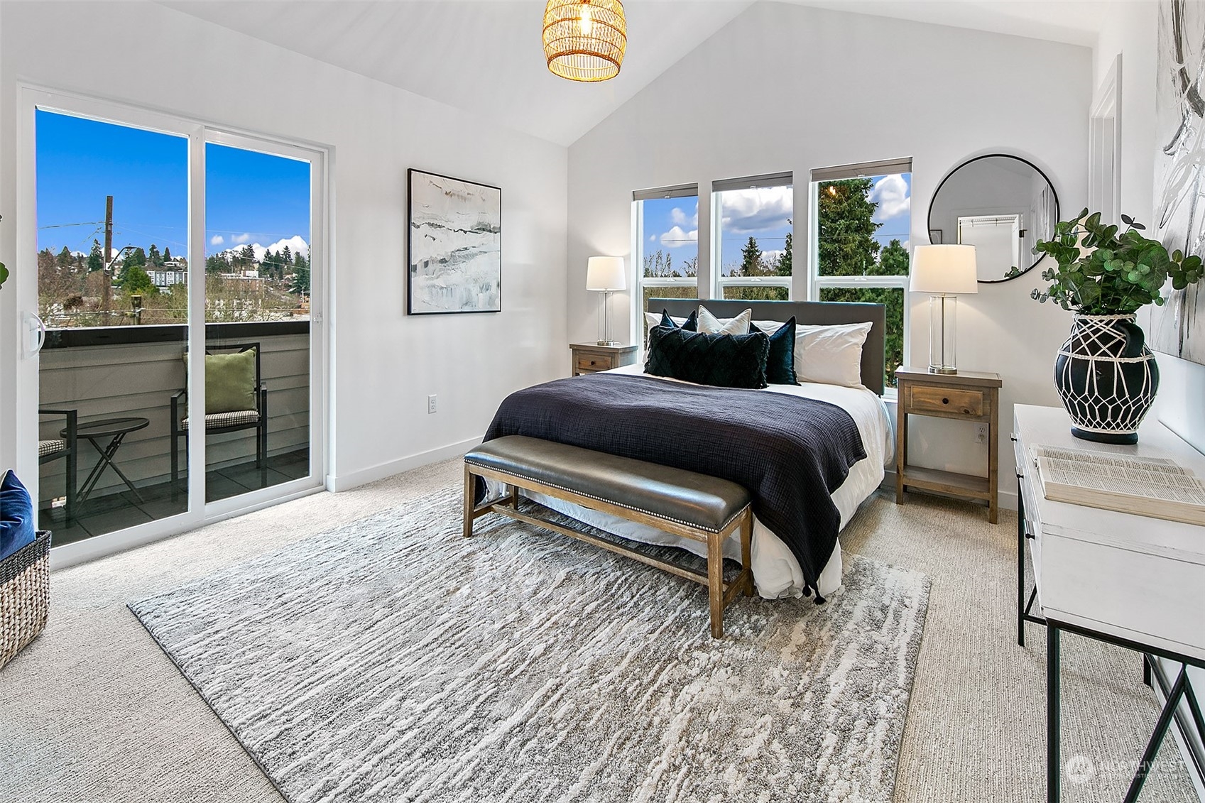 8855 29th Avenue Southwest Seattle, WA 98126 - Photo 17 of 20 a bedroom with a bed a table and potted plants with wooden floor