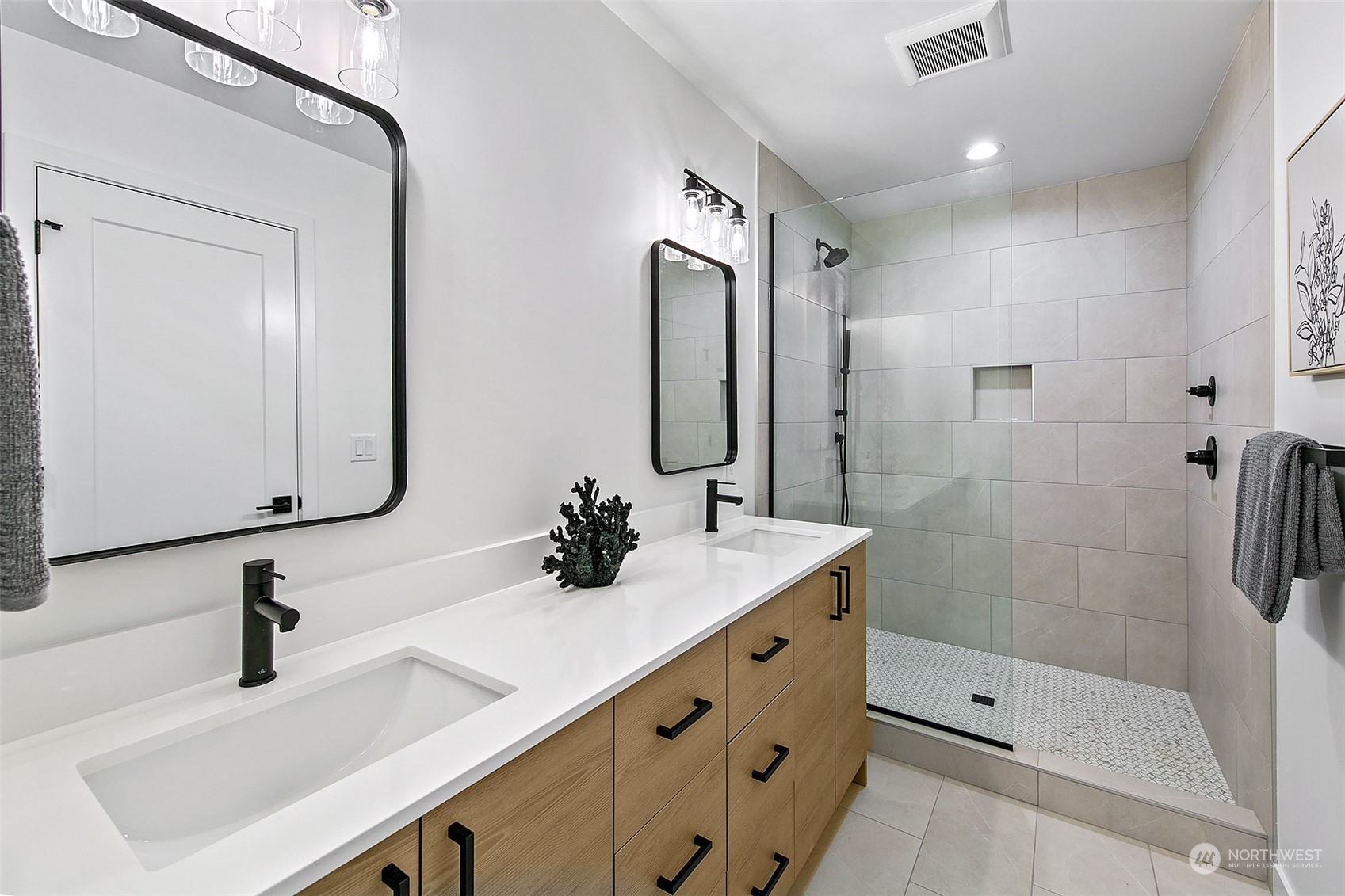 8855 29th Avenue Southwest Seattle, WA 98126 - Photo 19 of 20 a bathroom with a sink double vanity and shower