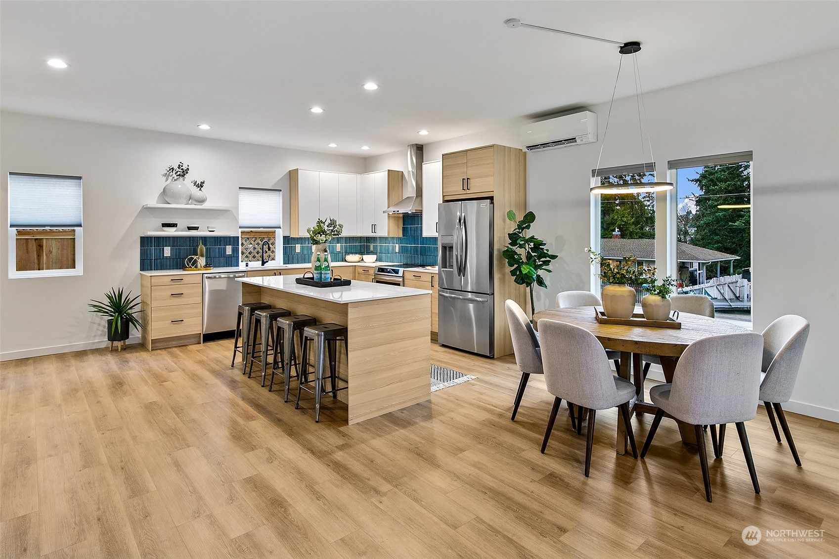 8855 29th Avenue Southwest Seattle, WA 98126 - Photo 7 of 20 a dining room with stainless steel appliances granite countertop a table and chairs