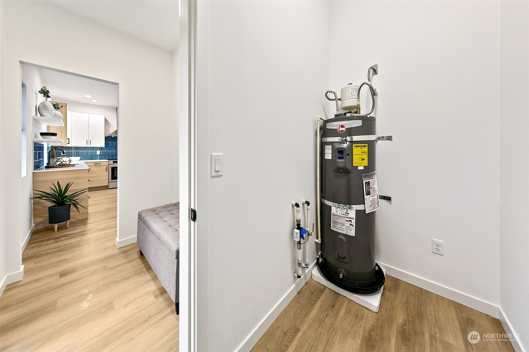 8855 29th Avenue Southwest Seattle, WA 98126 - Photo 10 of 20 a view of a hallway with wooden floor and furniture