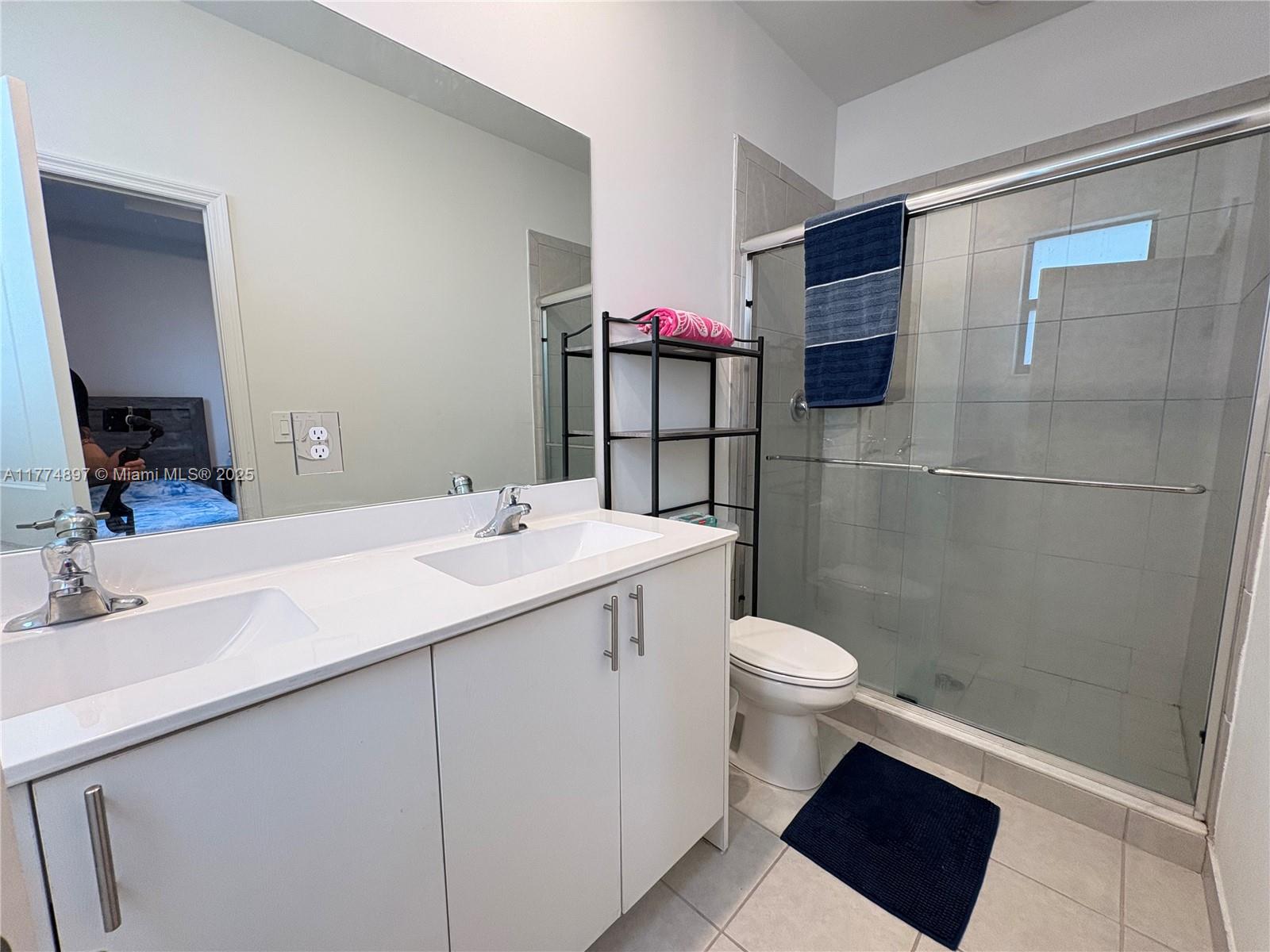 11772 Southwest 247th Terrace, Unit 11772 Homestead, FL 33032 - Photo 11 of 27 a bathroom with a sink toilet and shower