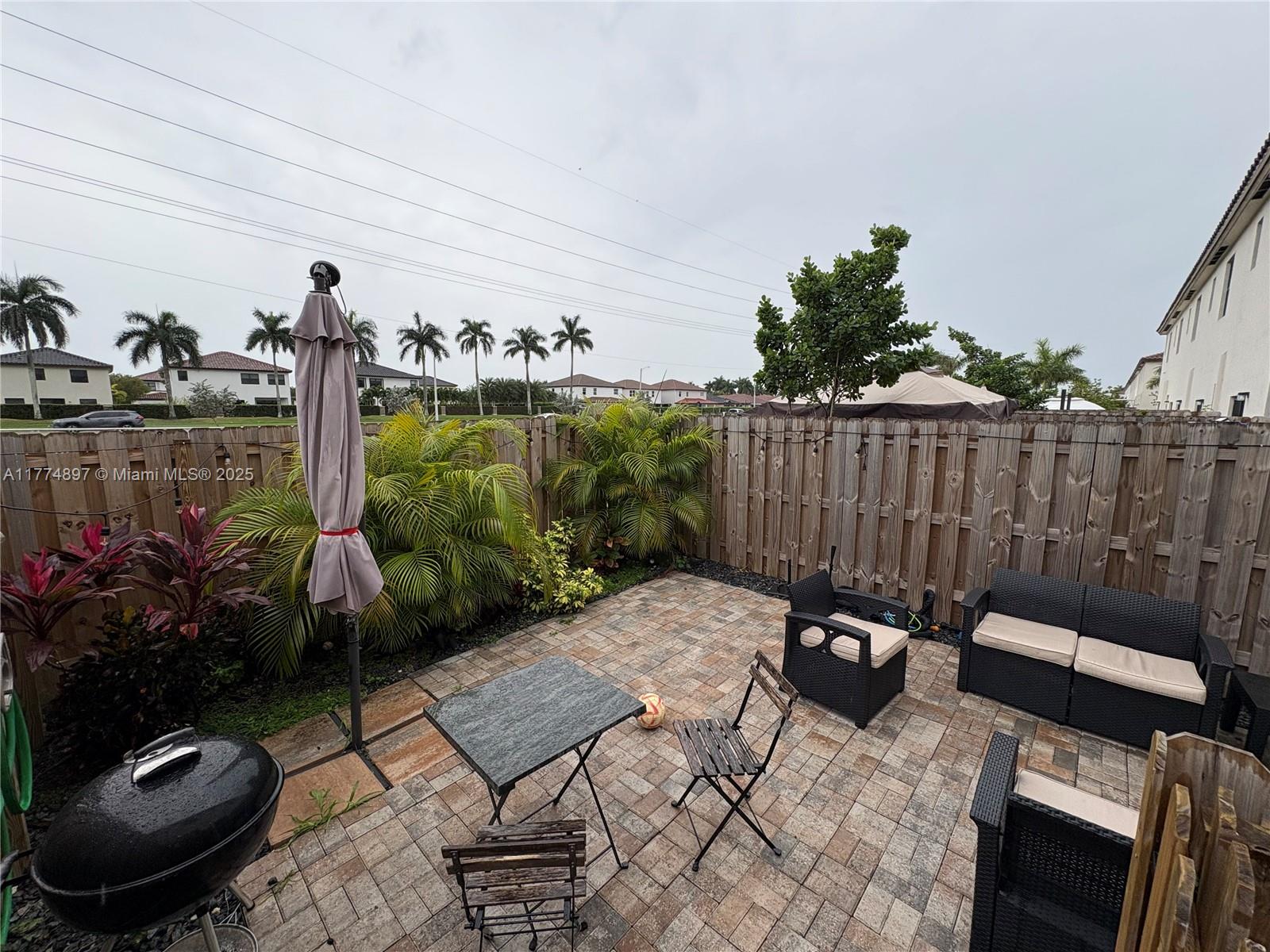 11772 Southwest 247th Terrace, Unit 11772 Homestead, FL 33032 - Photo 19 of 27 a view of outdoor space yard and patio