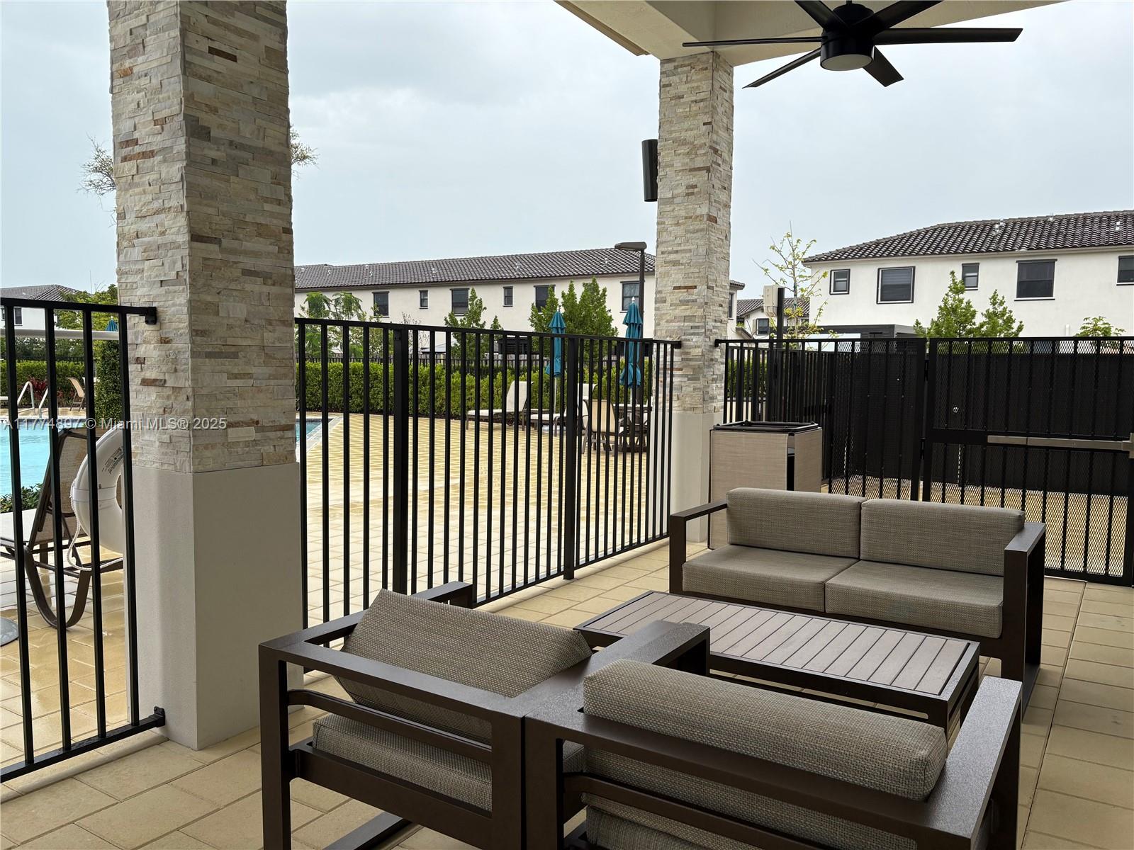 11772 Southwest 247th Terrace, Unit 11772 Homestead, FL 33032 - Photo 24 of 27 a view of outdoor living space with furniture