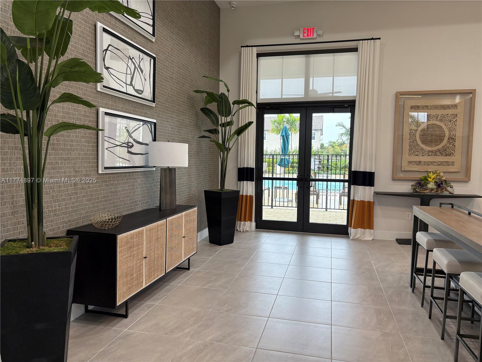 11772 Southwest 247th Terrace, Unit 11772 Homestead, FL 33032 - Photo 26 of 27 a view of an entryway with a livingroom