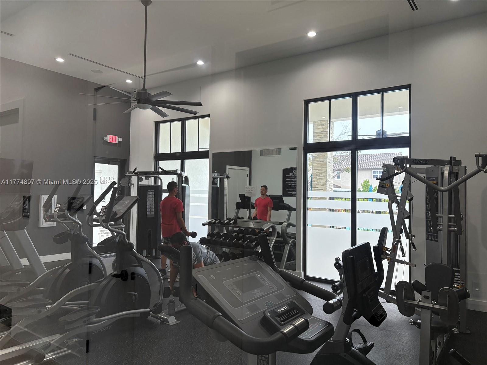 11772 Southwest 247th Terrace, Unit 11772 Homestead, FL 33032 - Photo 27 of 27 a view of a room with gym equipment