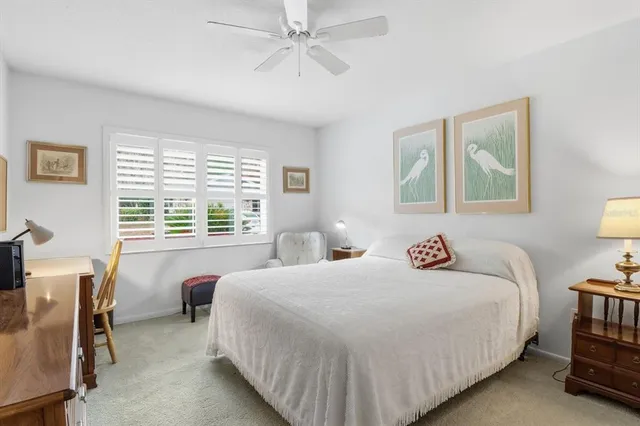 a bedroom with a bed furniture and a window
