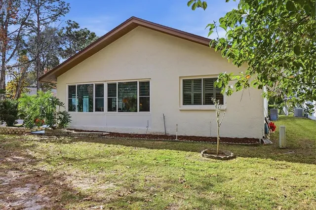 a view of house with yard