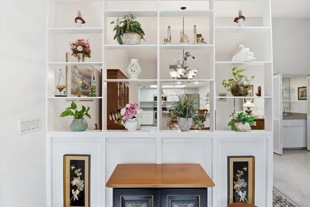 a room with table and painting on the wall