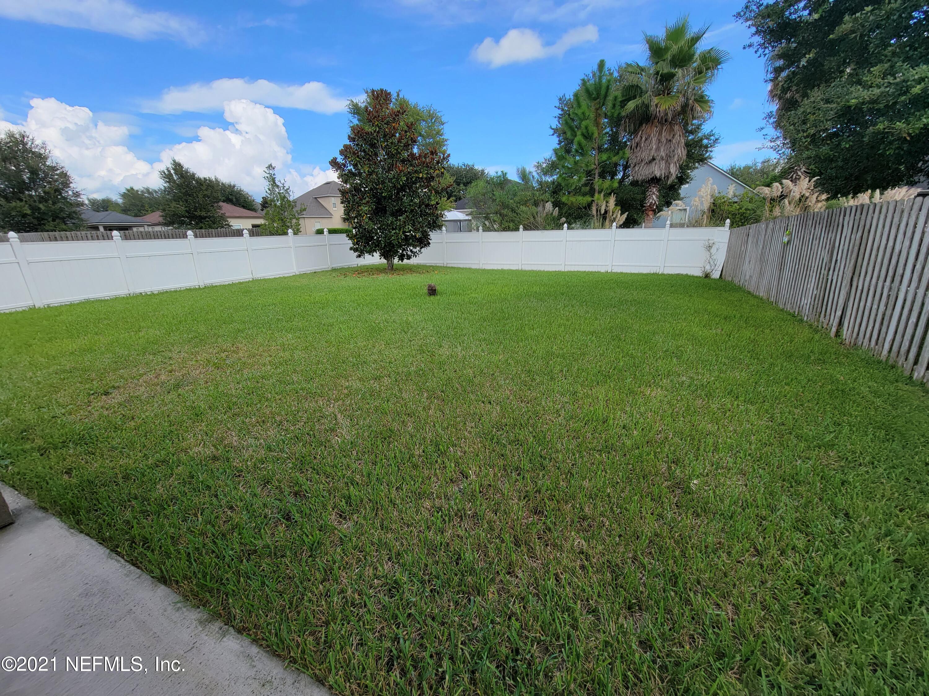13471 Devan Lee Drive East Jacksonville, FL 32226 - Photo 6 of 10 a view of a yard and a houses