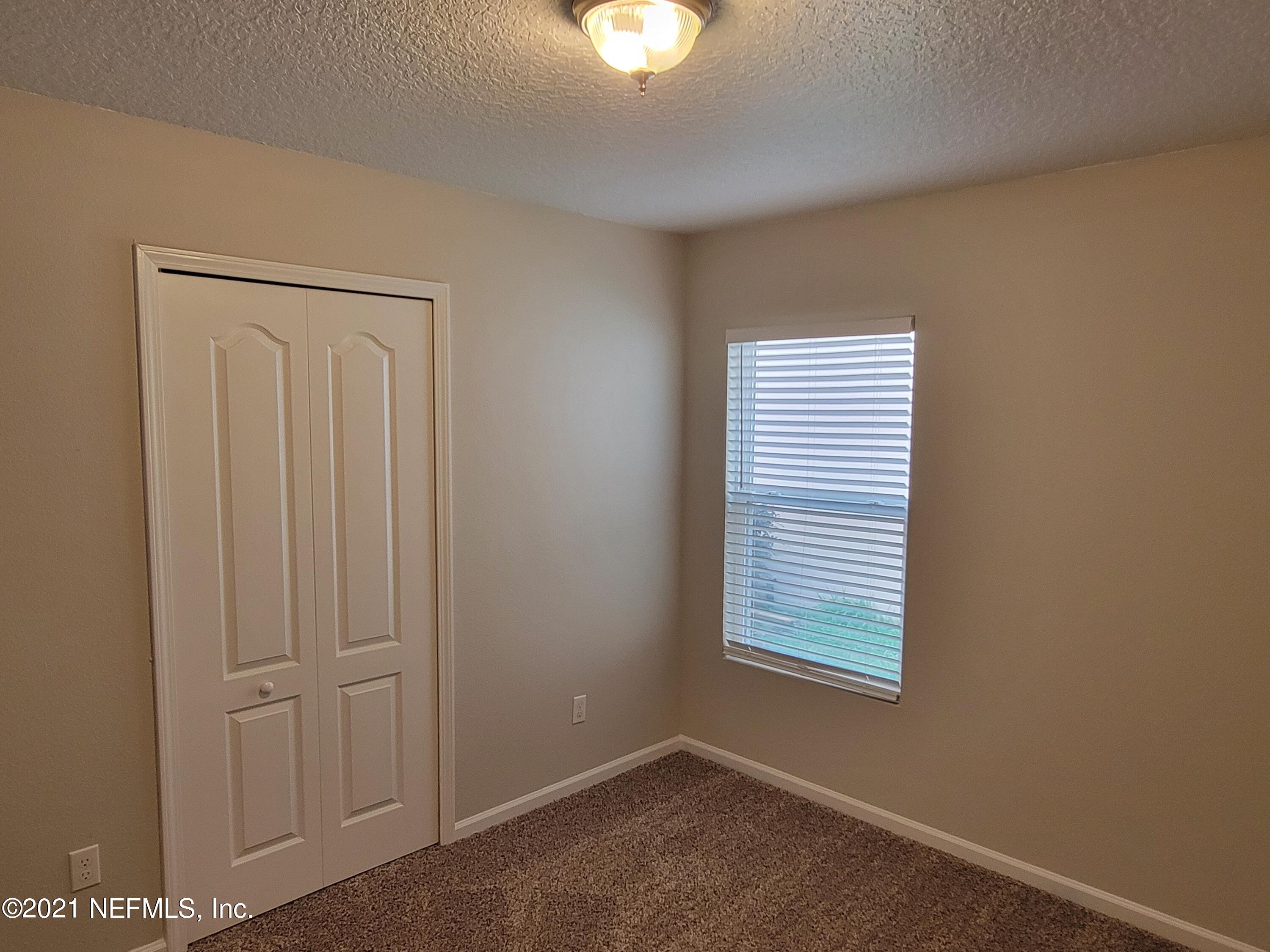 13471 Devan Lee Drive East Jacksonville, FL 32226 - Photo 8 of 10 a view of an empty room with a window