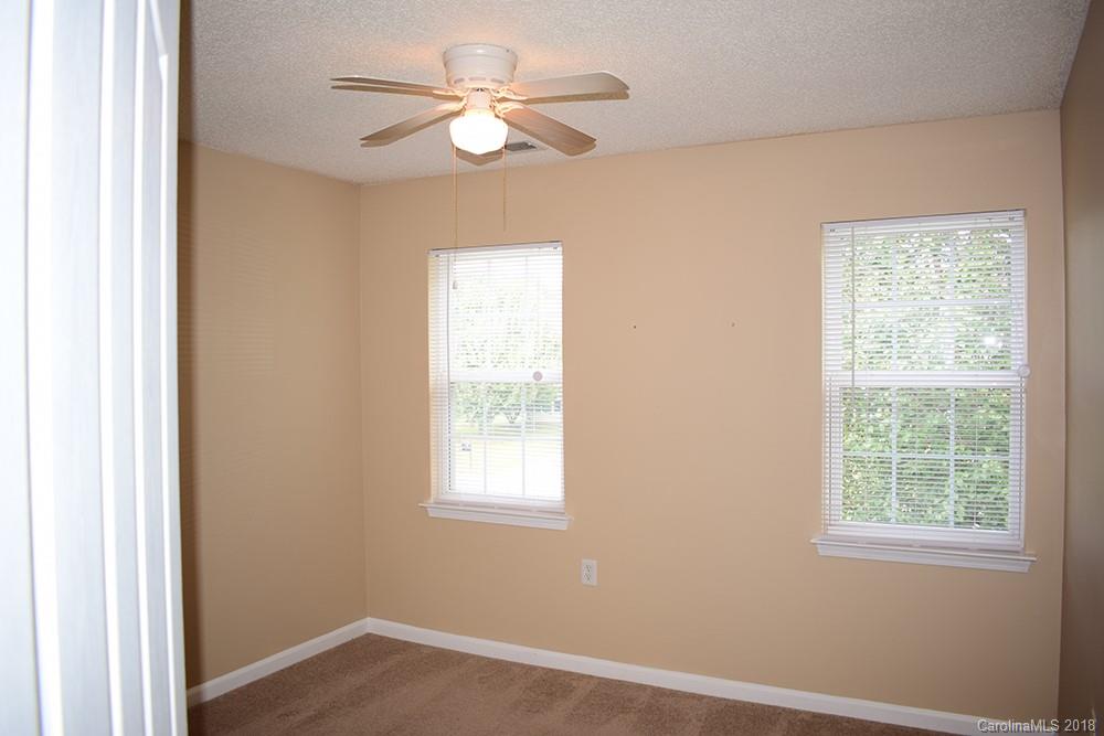138 Bluffton Road Mooresville, NC 28115 - Photo 12 of 19 an empty room with windows and fan