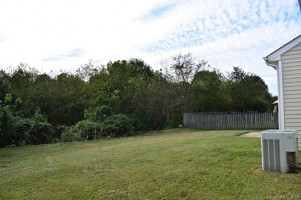 138 Bluffton Road Mooresville, NC 28115 - Photo 15 of 19 a view of a backyard with a small cabin
