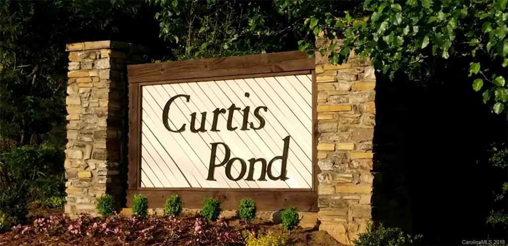138 Bluffton Road Mooresville, NC 28115 - Photo 17 of 19 a sign on the side of a building