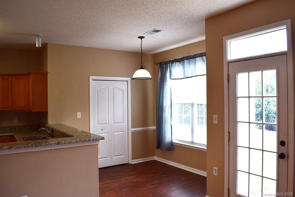 138 Bluffton Road Mooresville, NC 28115 - Photo 6 of 19 a kitchen with stainless steel appliances granite countertop a refrigerator a sink dishwasher a stove and a refrigerator with wooden floor