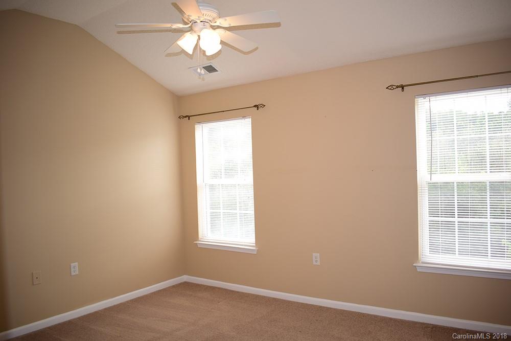 138 Bluffton Road Mooresville, NC 28115 - Photo 10 of 19 an empty room with a window and a fan