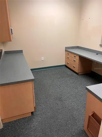 a utility room with cabinets