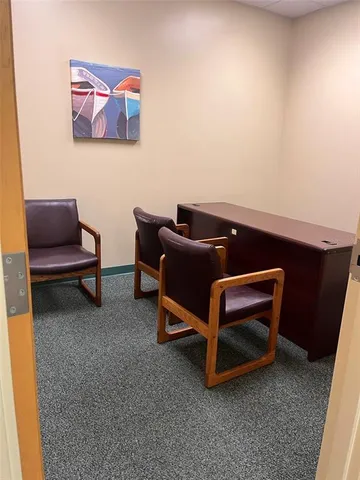 a kitchen with granite countertop cabinets and white appliances
