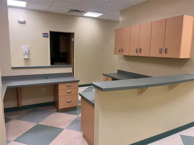 a utility room with cabinets