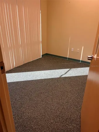 a view of a hallway with a white walls