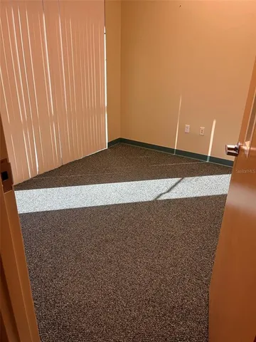 a view of a hallway with a white walls