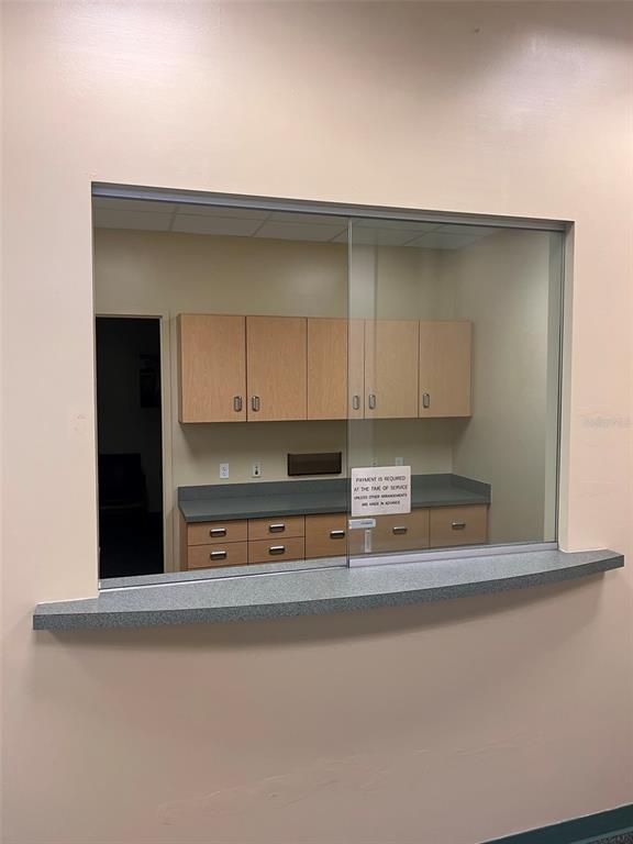 5999 Dundee Road, Unit 800 Winter Haven, FL 33881 - Photo 10 of 20 a kitchen with a cabinets and a stove top oven