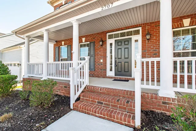 a front view of a house with a porch