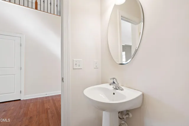 a bathroom with a sink a mirror and a vanity