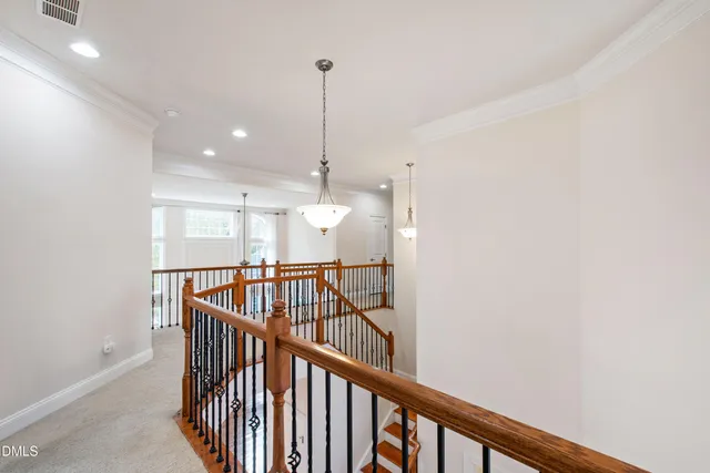 a view of an empty room with stairs