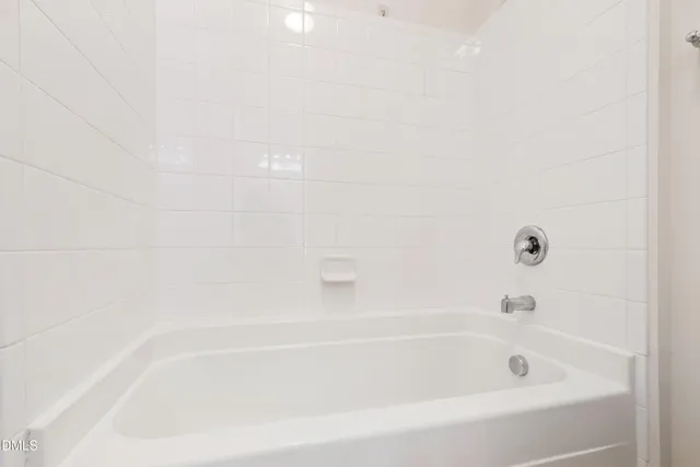 a close up of a bathtub in a bathroom