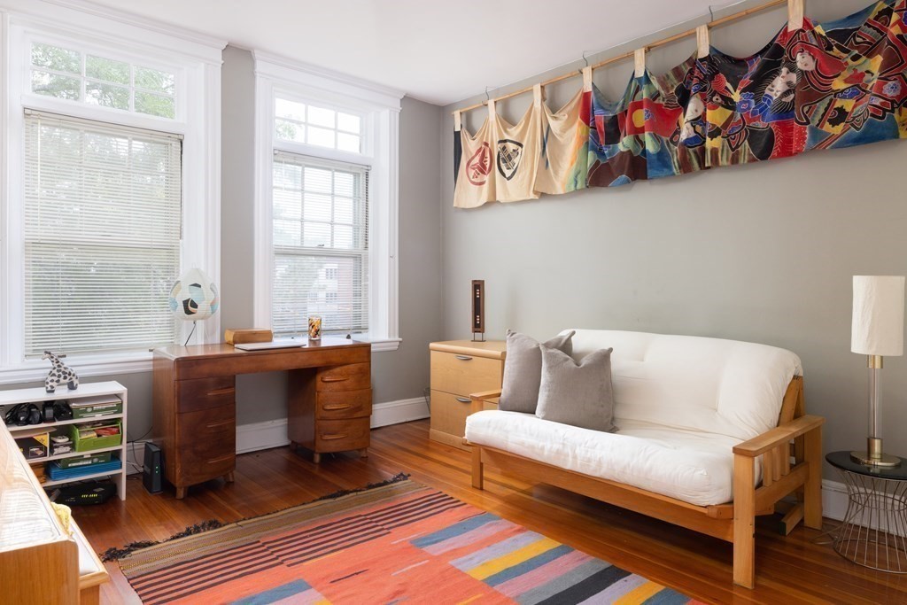 21 Strathmore Road, Unit 3 Brookline, MA 02445 - Photo 7 of 20 a living room with furniture and a window