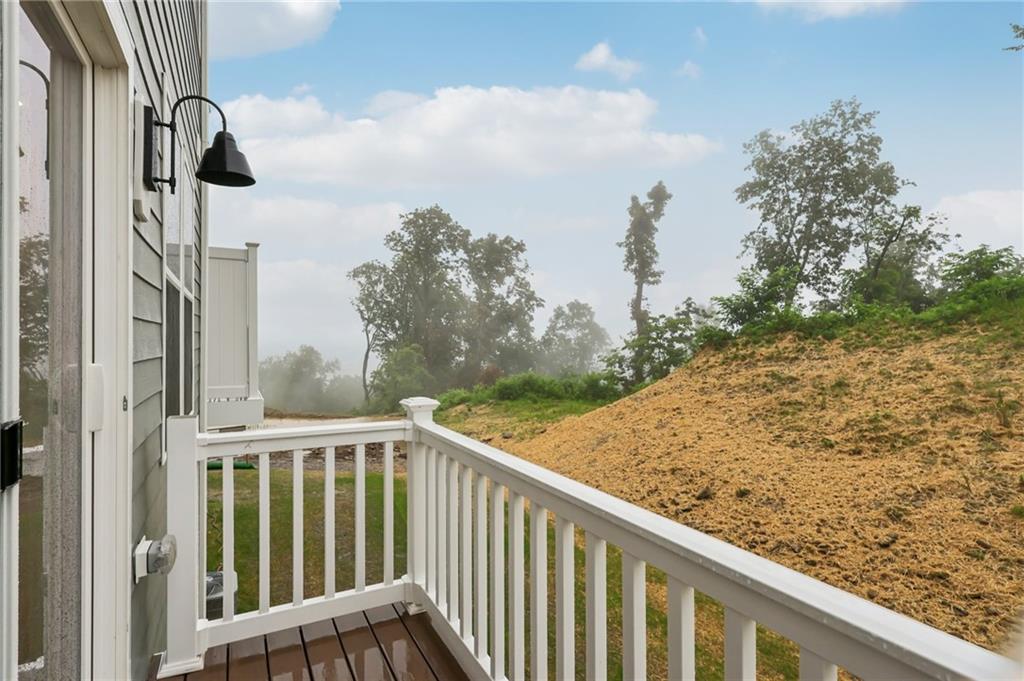 116 River Ridge Drive Coraopolis, PA 15108 - Photo 23 of 27 a view of a balcony with wooden floor and fence
