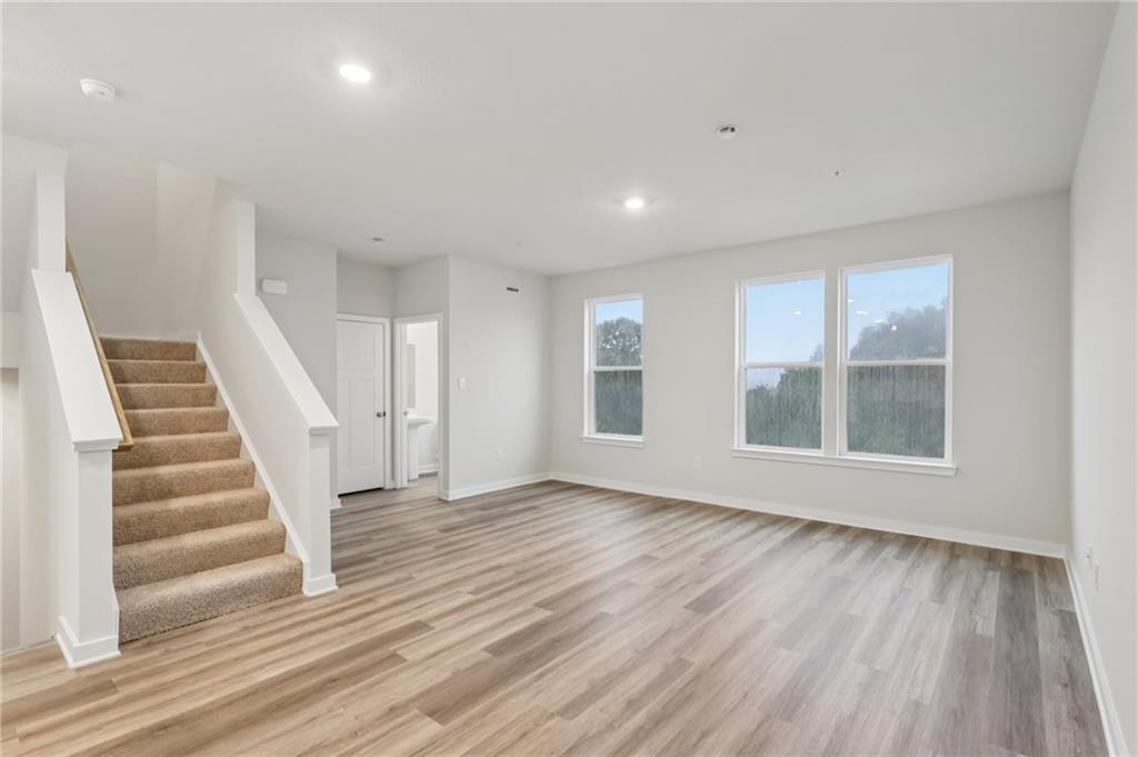 116 River Ridge Drive Coraopolis, PA 15108 - Photo 4 of 27 a view of an empty room with wooden floor and windows