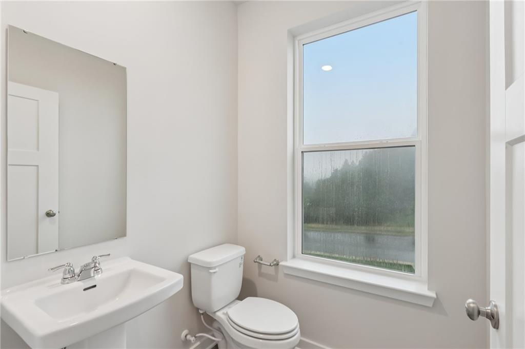 116 River Ridge Drive Coraopolis, PA 15108 - Photo 9 of 27 a bathroom with a sink mirror and toilet