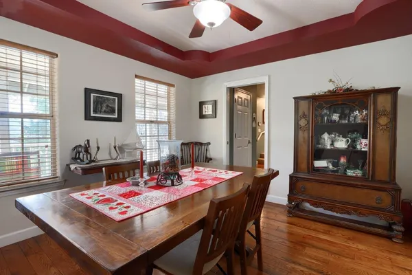 a dining room with furniture and window