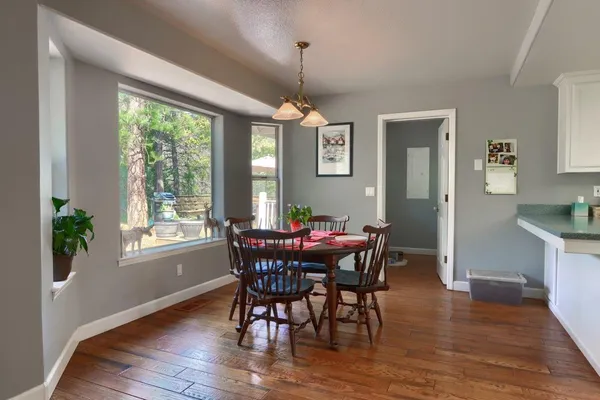 a view of a dining room with furniture window and wooden floor