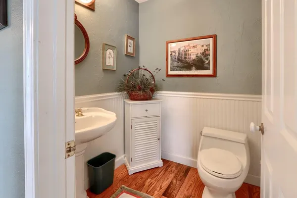 a bathroom with a toilet and a sink