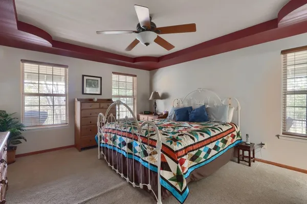 a bedroom that has a bed and a table in it