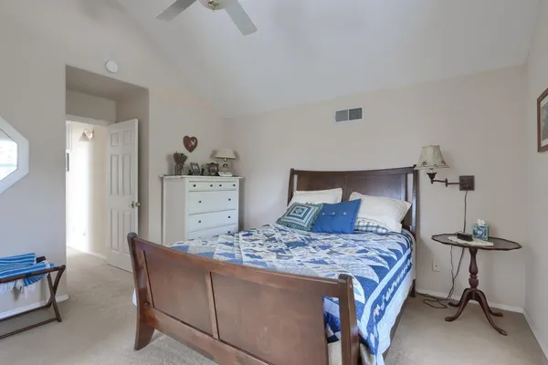 a bedroom with a bed and dresser