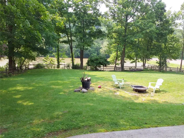 a view of a park with large trees